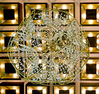 Artist Willy J. Malarcher's Dodecahedron-shaped bronze and crystal chandeliers in the WV Culture Center